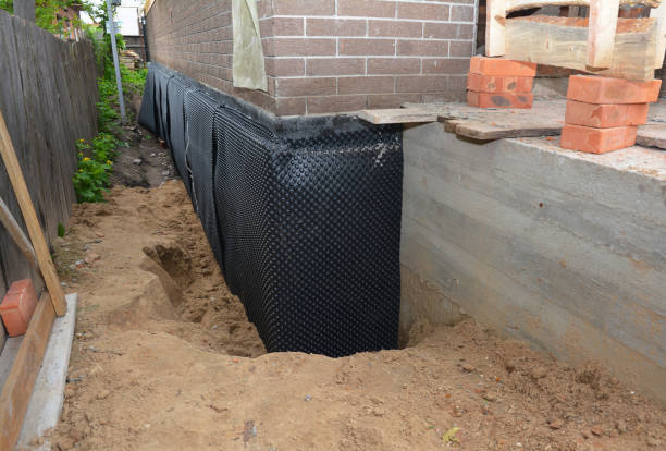 Happy homeowners after waterproofing job in Wilmington
